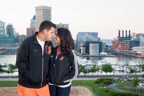 Couple wearing Orioles jackets in Baltimore  ||  What to wear for your engagement session  ||  Jennifer Smutek Photography  ||   Charm City Wed  ||   www.charmcitywed.com