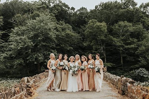 bridal party image of mismatched bridesmaids dresses from a wedding in Bowie MD. Photographer We Are The Cashmans.