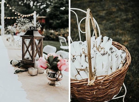 Lanters and roses in teacups placed on lace for the outdoor wedding reception in Bowie Maryland. 