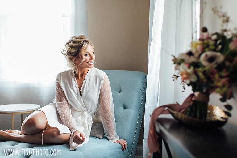Bride on an aqua settee • tPoz Photography