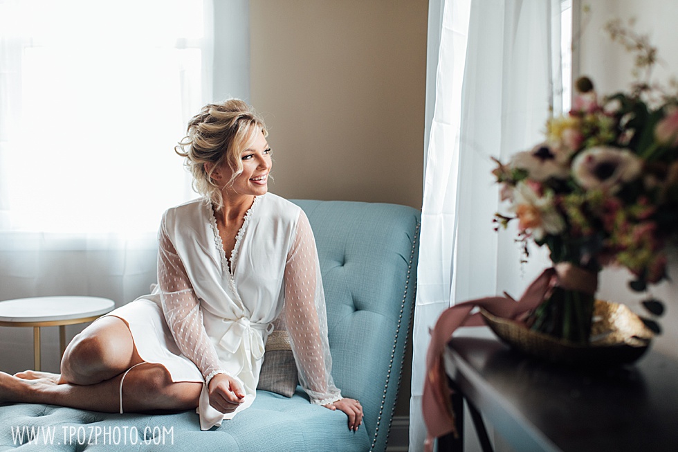 Bride on an aqua settee • tPoz Photography