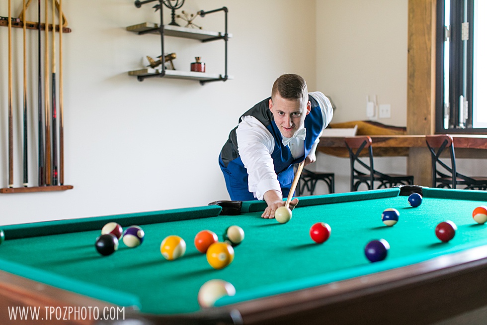Groom playing pool at Rosewood Farms  • tPoz Photography