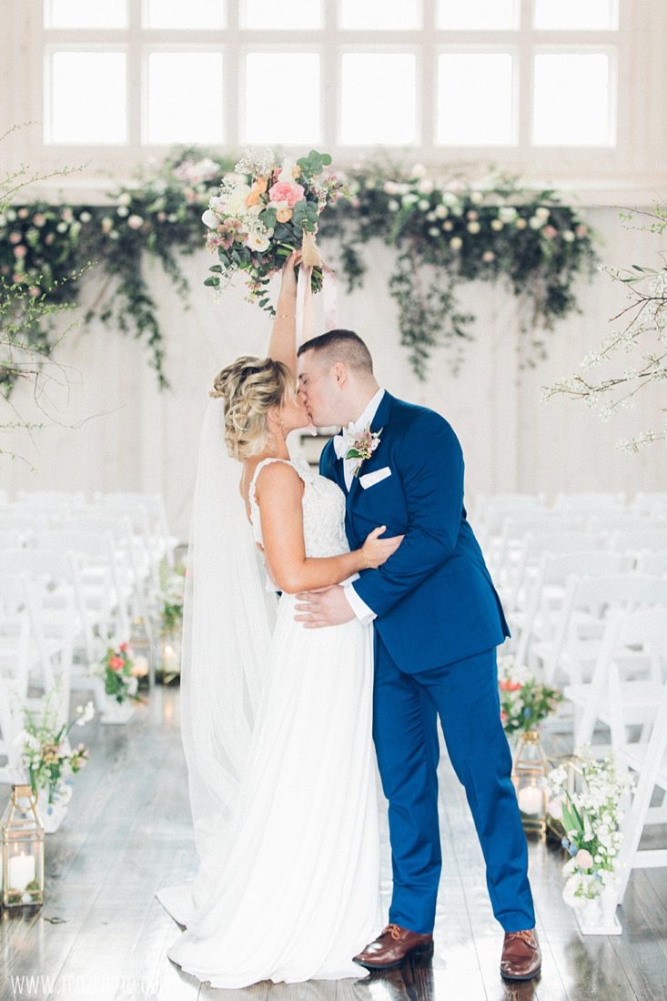 Bride Cheering at Rosewood's Rustic Barn Wedding Ceremony • tPoz Photography